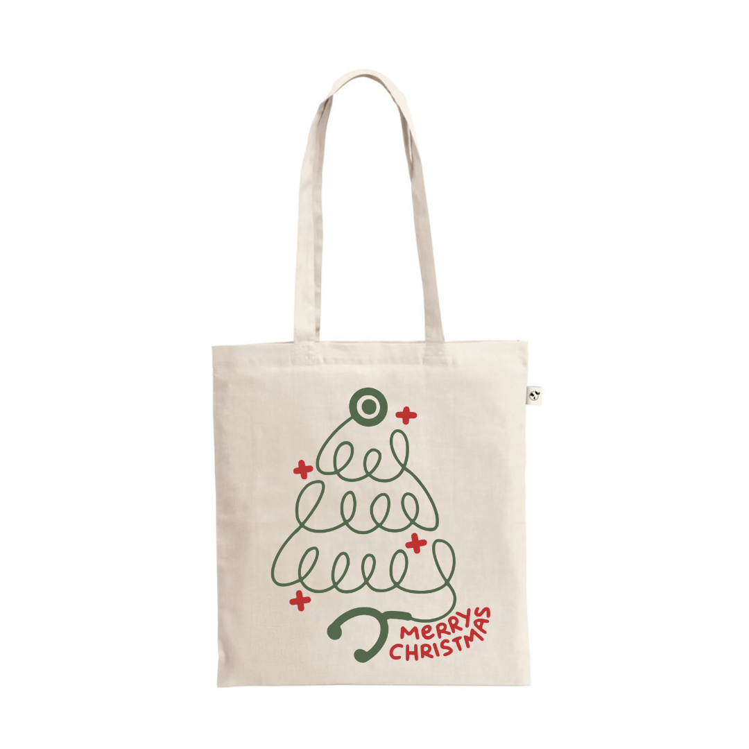 A natural cotton tote bag featuring a minimalist Christmas tree design created by a green stethoscope outline, with red medical cross accents and the text "Merry Christmas."