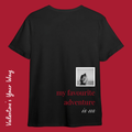 Back view of a custom black t-shirt featuring a custom black and white photo in a white scalloped frame with red and white text saying "my favourite adventure is us."