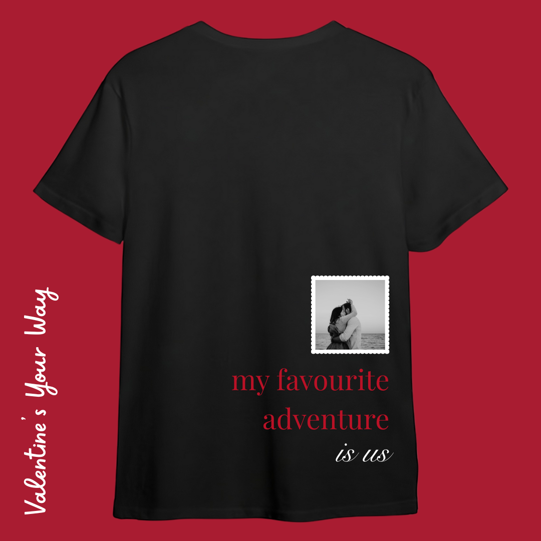 Back view of a custom black t-shirt featuring a custom black and white photo in a white scalloped frame with red and white text saying "my favourite adventure is us."